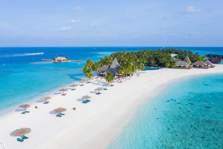 This Maldives Resort Is Known for Its Epic Sandbank, Crystal Lagoon, and Romantic Island Vibes